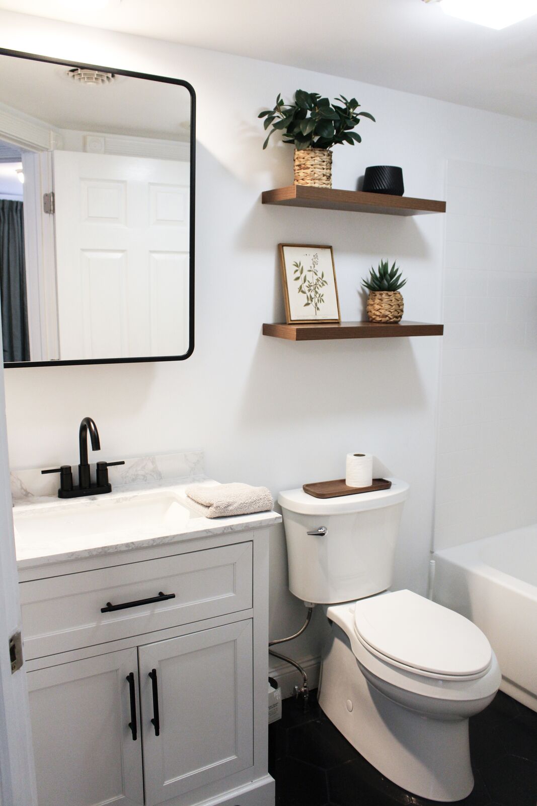 Hall bath with floating shelves