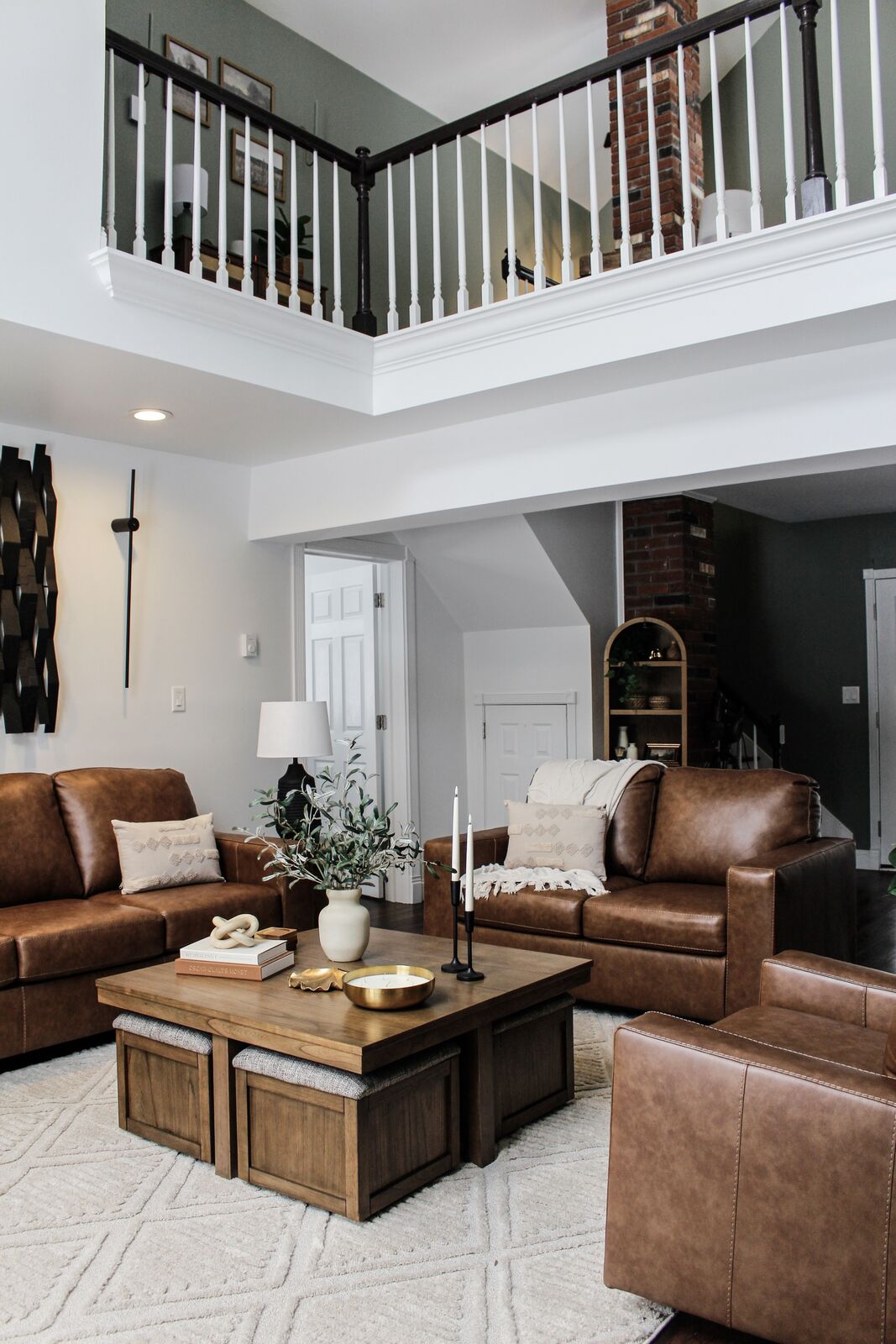 Two-story great room with brick chimney and 24-foot picture window