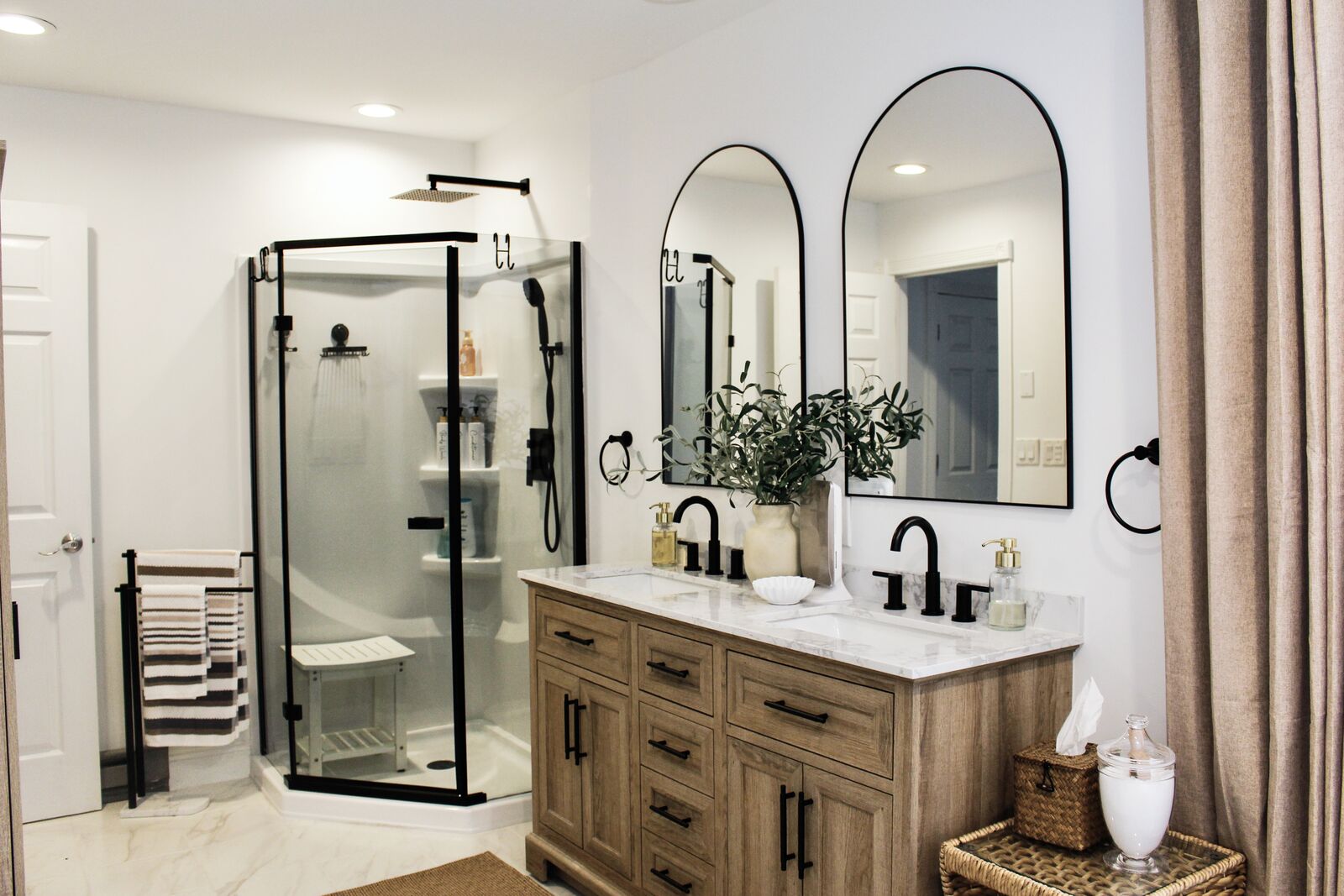 Twin arched mirrors over primary vanity
