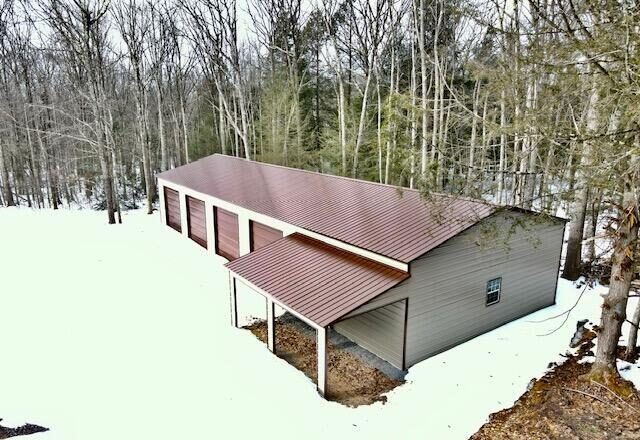 Aerial view of the pole barn in winter snow